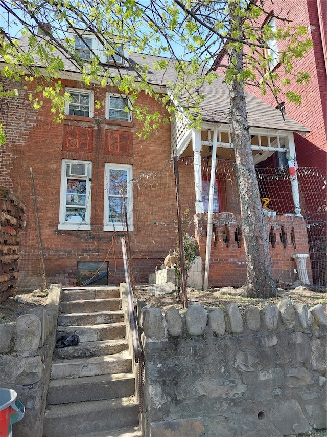 exterior space featuring brick siding
