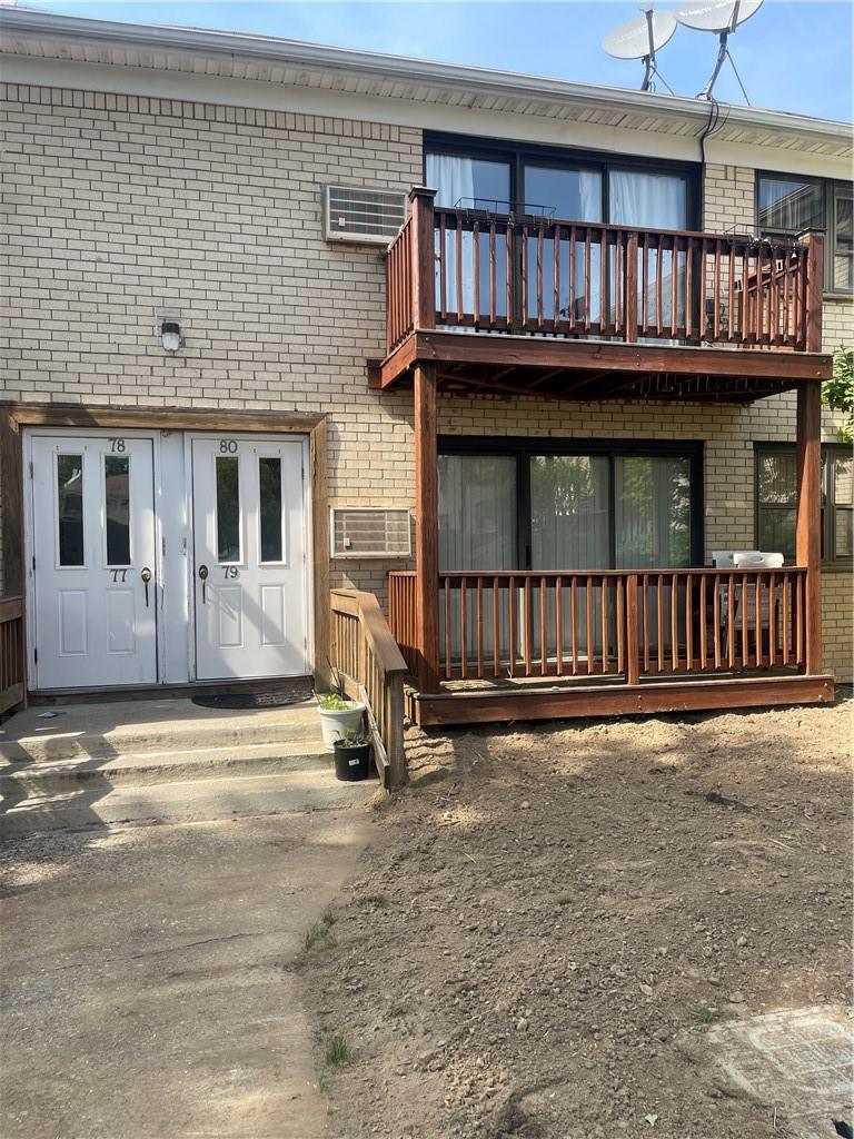 rear view of property featuring a balcony