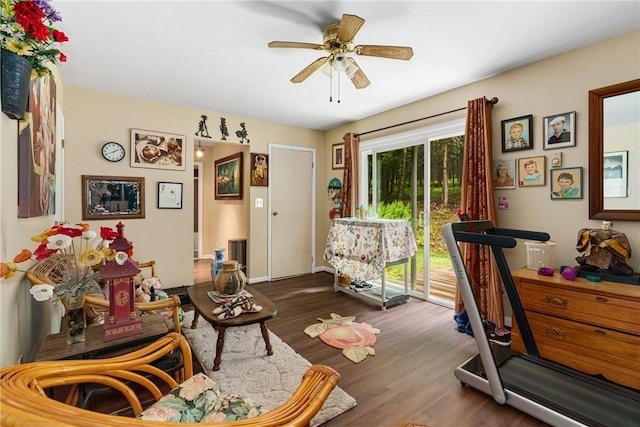 interior space with ceiling fan and dark hardwood / wood-style floors