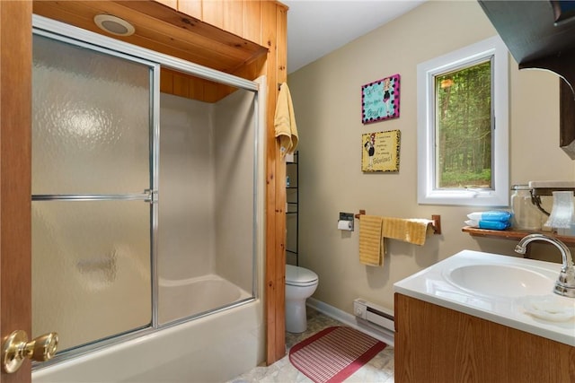 full bathroom with vanity, toilet, baseboard heating, and bath / shower combo with glass door