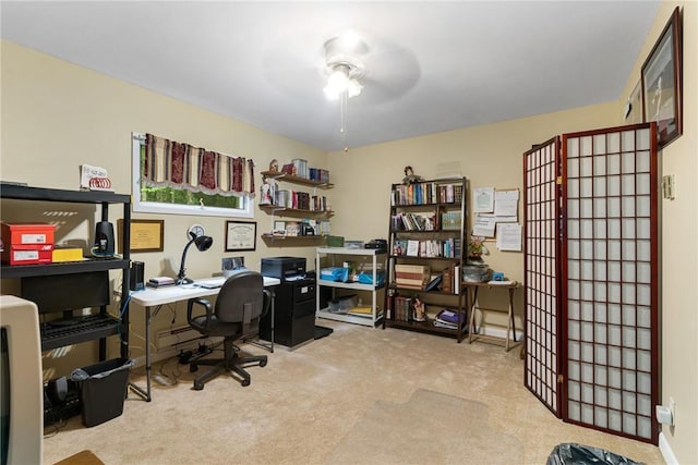 home office with ceiling fan and light colored carpet