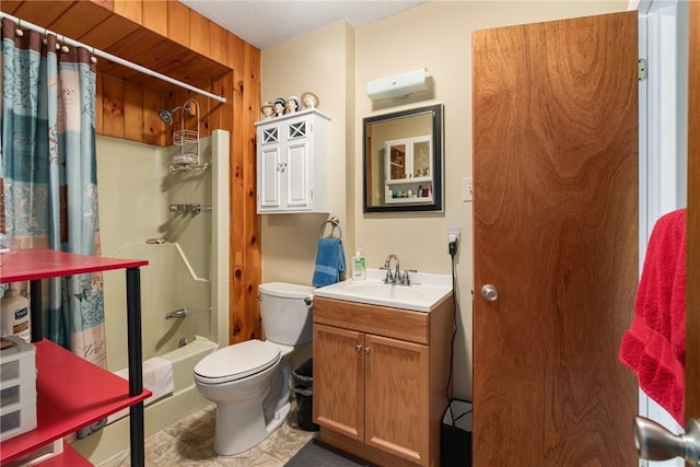 full bathroom with shower / bath combination with curtain, vanity, a textured ceiling, and toilet