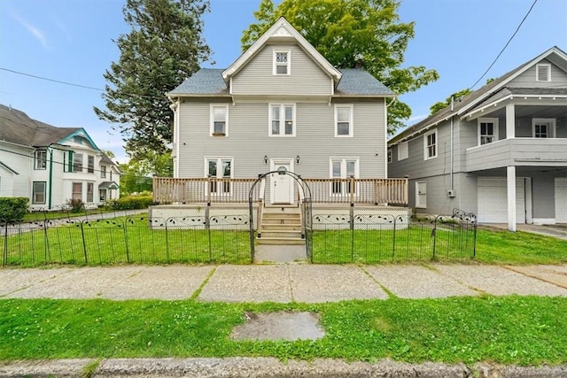 view of front of home with covered porch and a front lawn