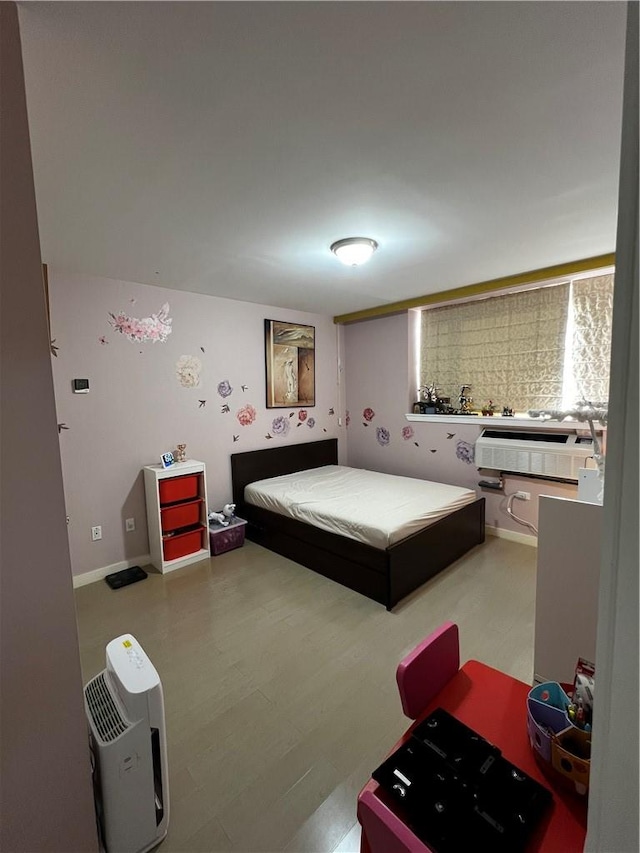 bedroom with wood-type flooring