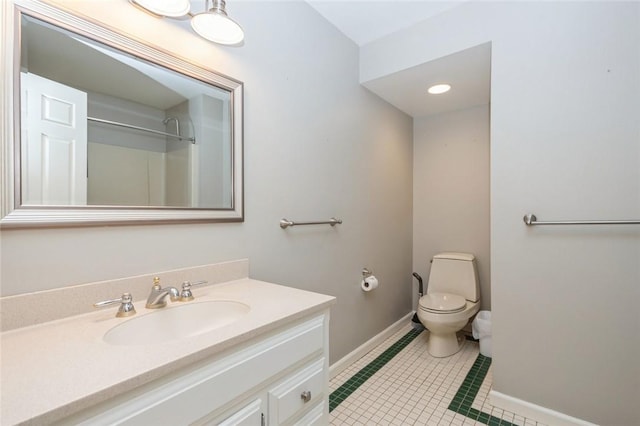 bathroom with tile patterned floors, walk in shower, vanity, and toilet