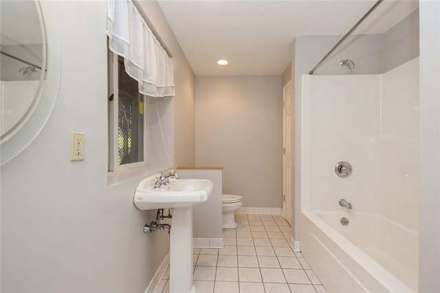 bathroom with tile patterned flooring, shower / tub combination, and toilet