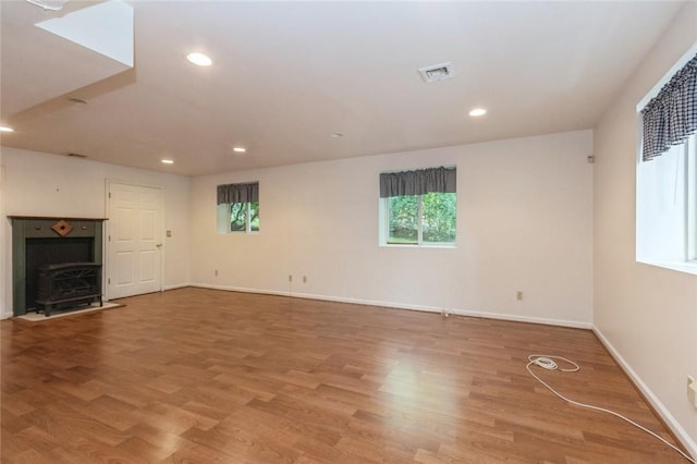 unfurnished living room featuring hardwood / wood-style floors