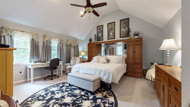 bedroom with ceiling fan, light carpet, and vaulted ceiling