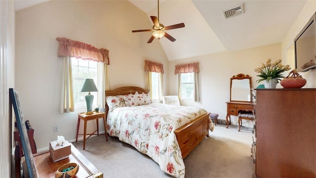 carpeted bedroom with ceiling fan, high vaulted ceiling, and multiple windows