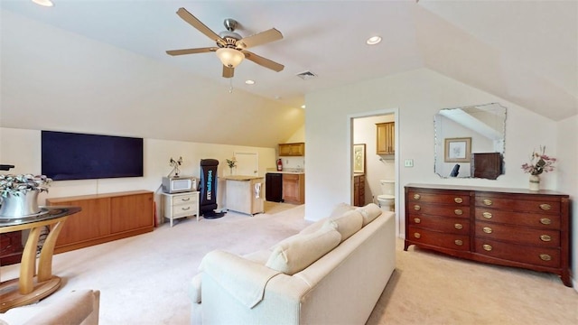 living room with light carpet, vaulted ceiling, and ceiling fan