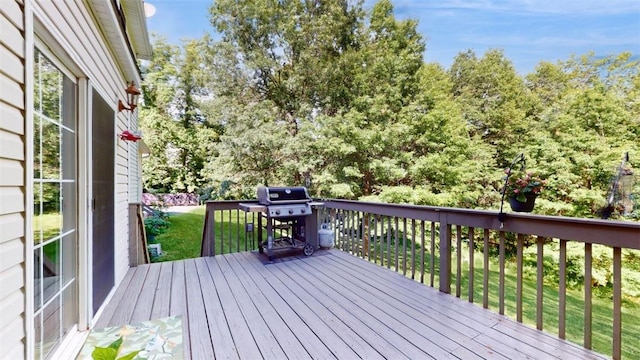 wooden deck featuring area for grilling