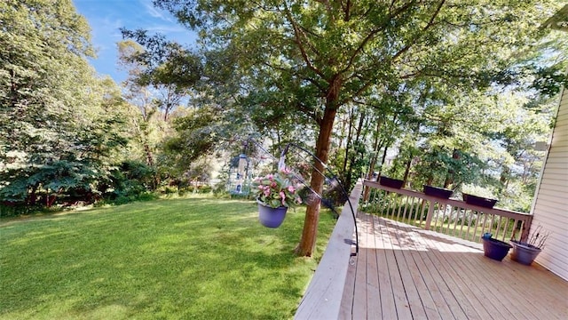 view of yard featuring a wooden deck