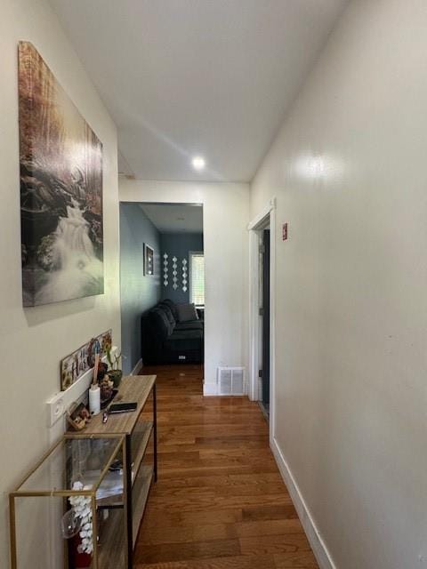 hallway featuring dark hardwood / wood-style flooring