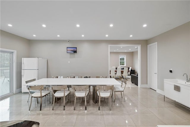 dining space featuring sink and a healthy amount of sunlight