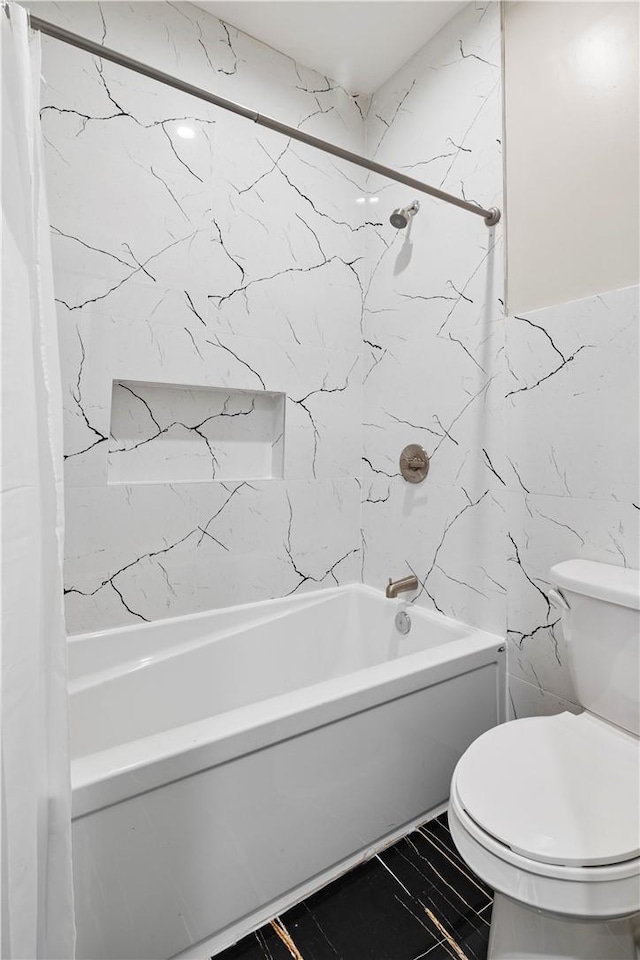 bathroom featuring shower / bath combo with shower curtain and toilet