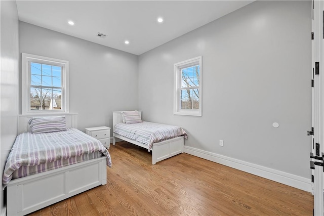 bedroom with light hardwood / wood-style floors