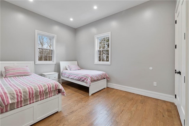 bedroom with light wood-type flooring