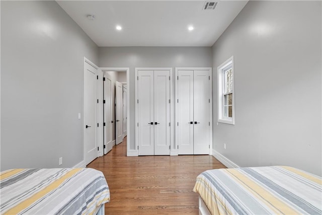 bedroom with wood-type flooring