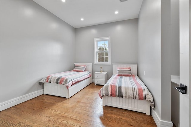 bedroom featuring light wood-type flooring