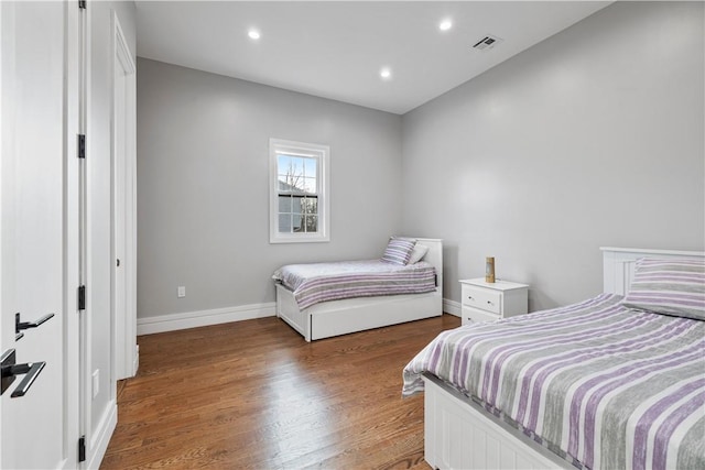 bedroom featuring hardwood / wood-style floors