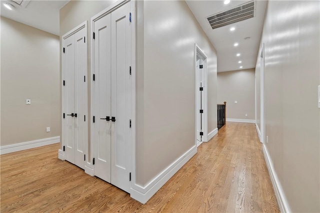 hall with light wood-type flooring