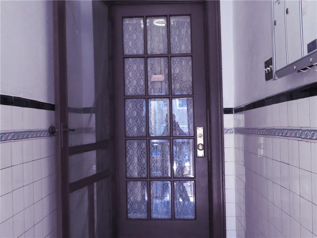 interior space featuring tile walls