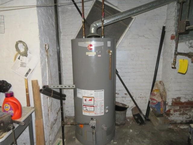 utility room with gas water heater