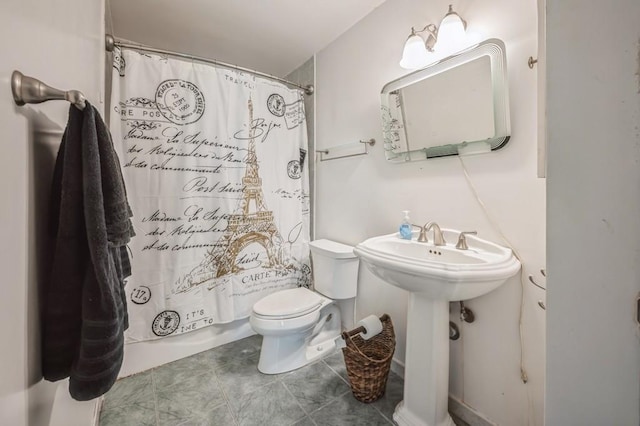 bathroom featuring tile patterned flooring and toilet