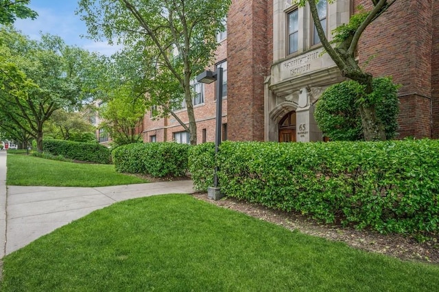 view of community featuring a lawn