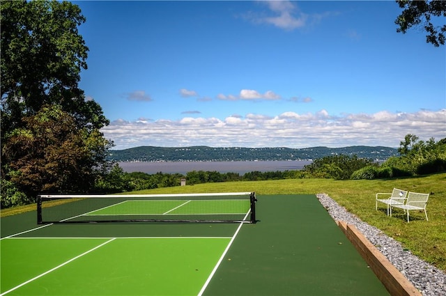 view of sport court with a mountain view