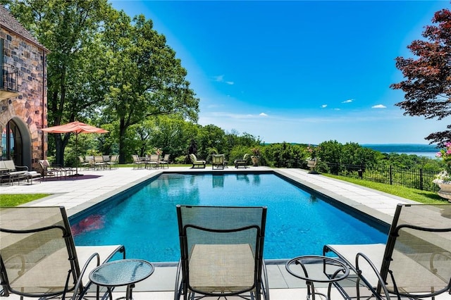 view of swimming pool with a patio