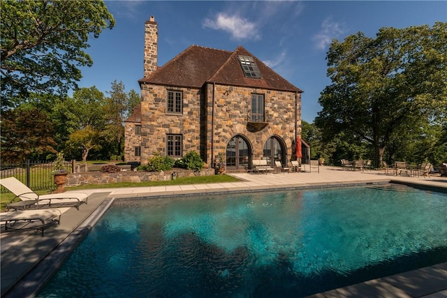 view of swimming pool featuring a patio area