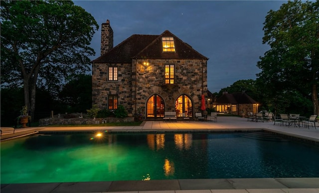 view of swimming pool with a patio area