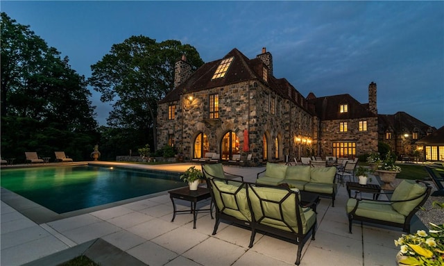 view of pool featuring a patio area and an outdoor hangout area