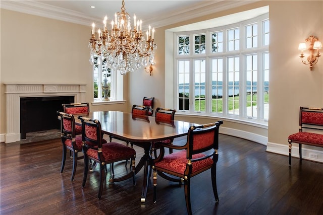 dining space featuring a water view, dark hardwood / wood-style flooring, and a wealth of natural light