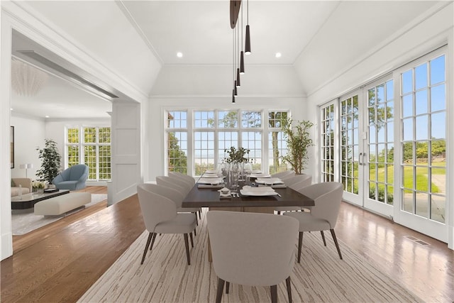 sunroom with french doors, vaulted ceiling, and a wealth of natural light