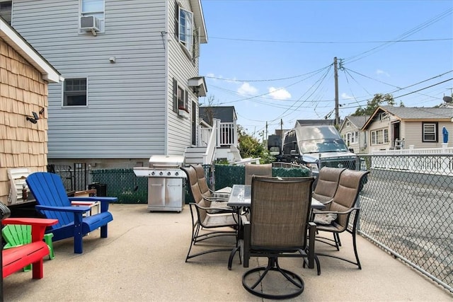 view of patio featuring area for grilling and cooling unit