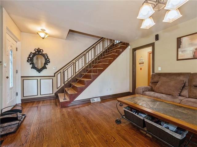 living room featuring dark wood-type flooring