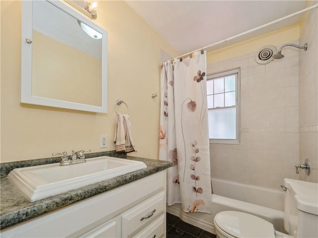 full bathroom featuring tile patterned floors, vanity, shower / bath combination with curtain, and toilet