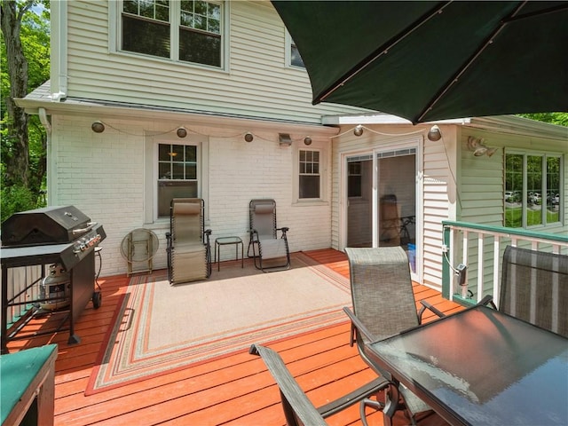 wooden deck with area for grilling