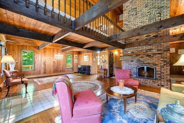 living room with a fireplace, wooden walls, hardwood / wood-style floors, and wooden ceiling