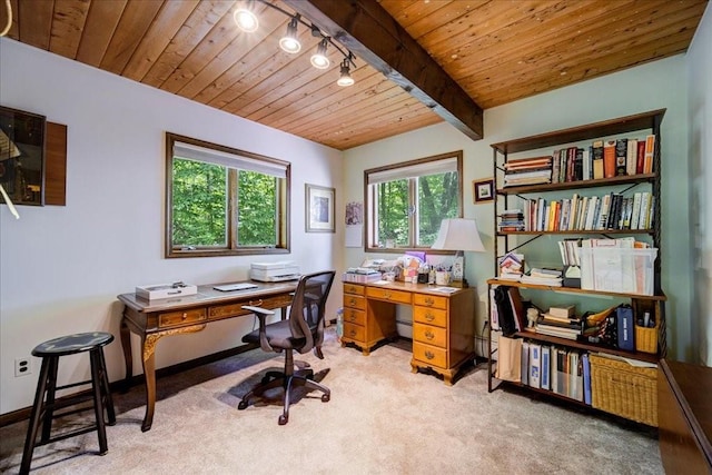 carpeted office space featuring beamed ceiling and wood ceiling