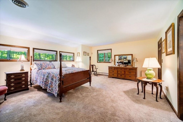 bedroom featuring light carpet and a baseboard radiator