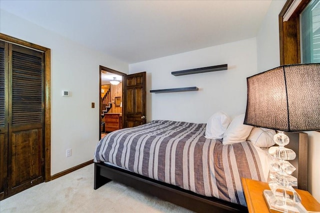 carpeted bedroom featuring a closet