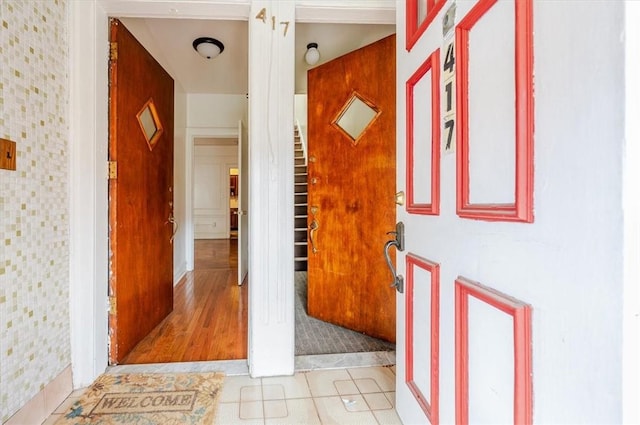 corridor with light tile patterned floors