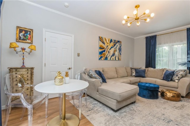 living room with a chandelier, wood-type flooring, and ornamental molding