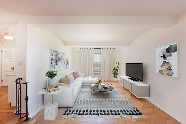 living room featuring beamed ceiling and light parquet floors