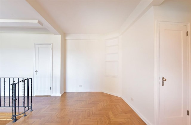 empty room with light parquet floors