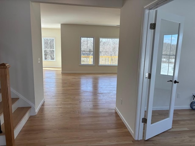 hallway with light wood-type flooring