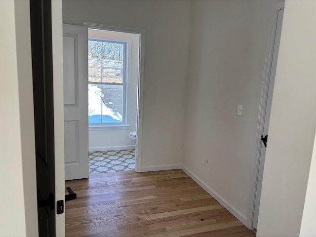 unfurnished room with light wood-type flooring